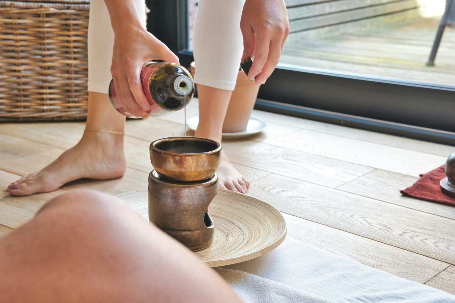person pouring coffee on brown ceramic mug